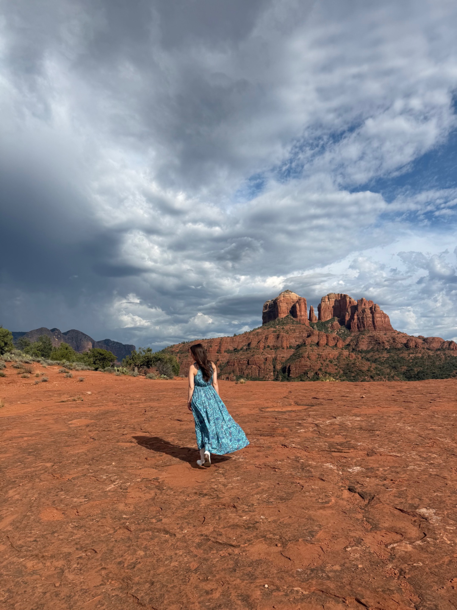 Jacquelyn in a blue dress in Sedona among the red rocks